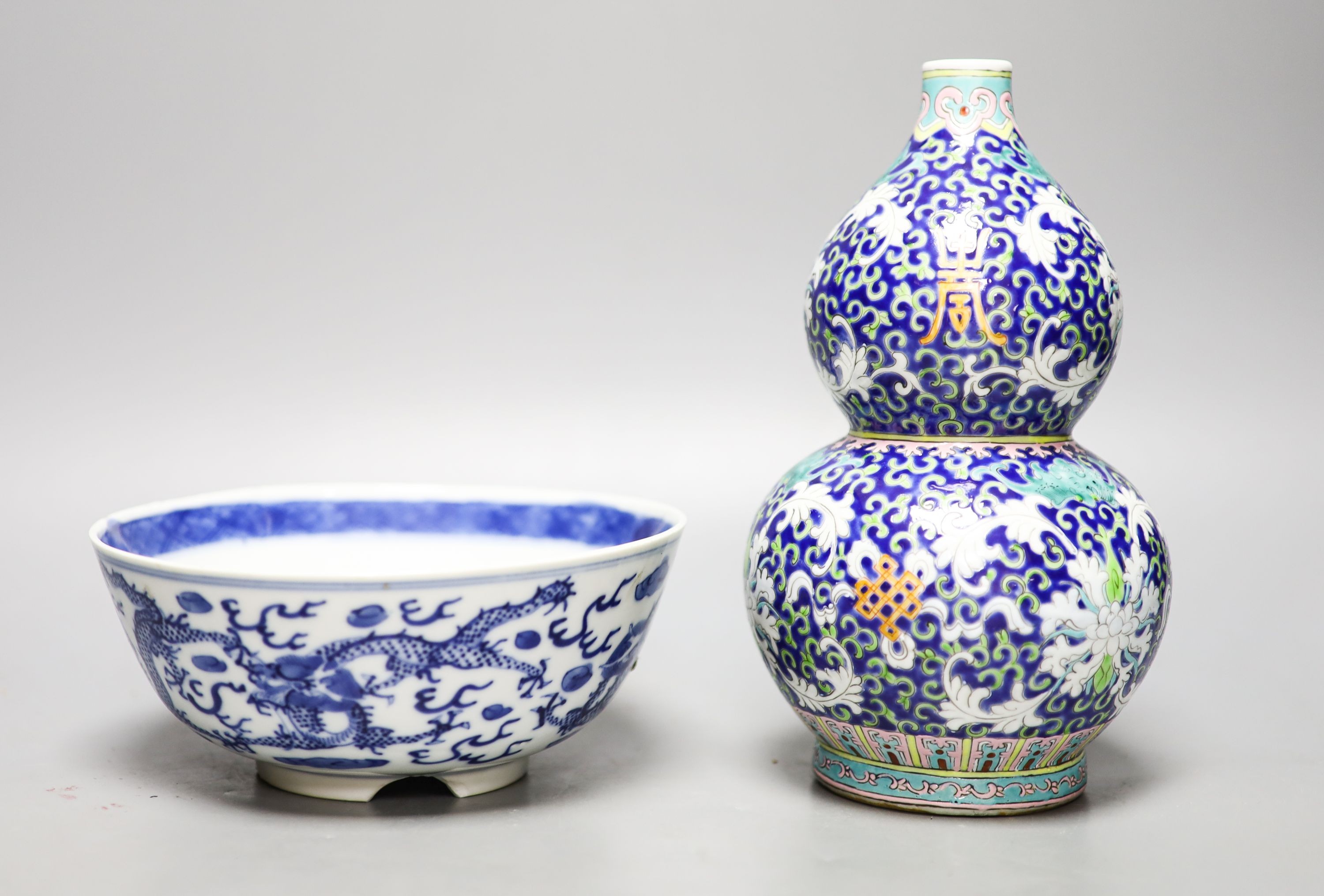 A 19th-century Chinese blue and white dragon bowl and a Chinese enamelled porcelain double gourd vase 22 cm high